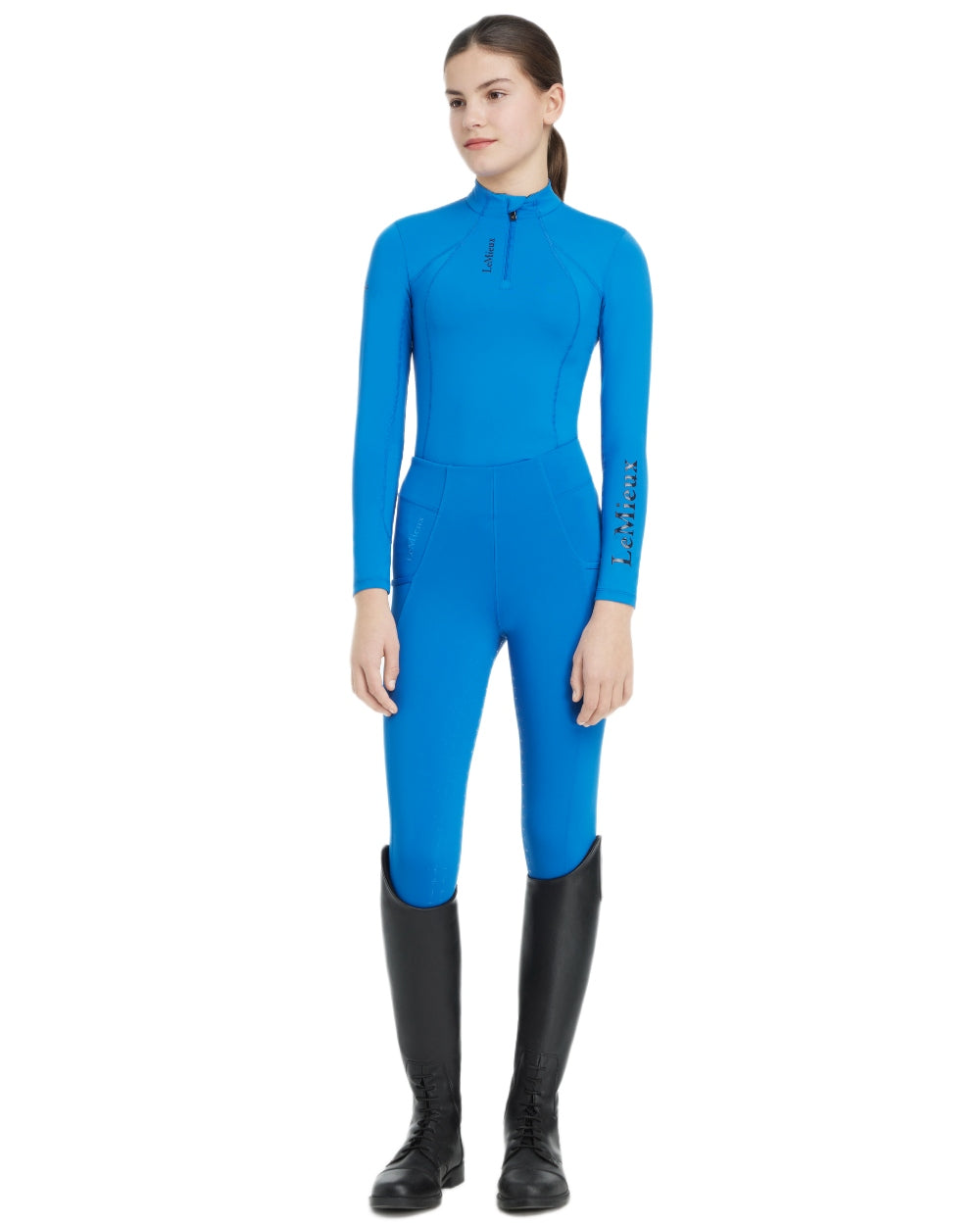 Benetton Blue coloured LeMieux Young Rider Classique Base Layer on white background
