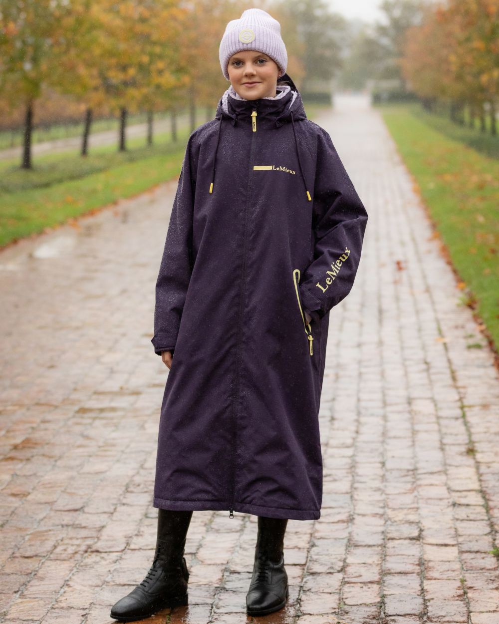 Juniper coloured LeMieux Young Rider HydroShield Robe Long Coat on tree background