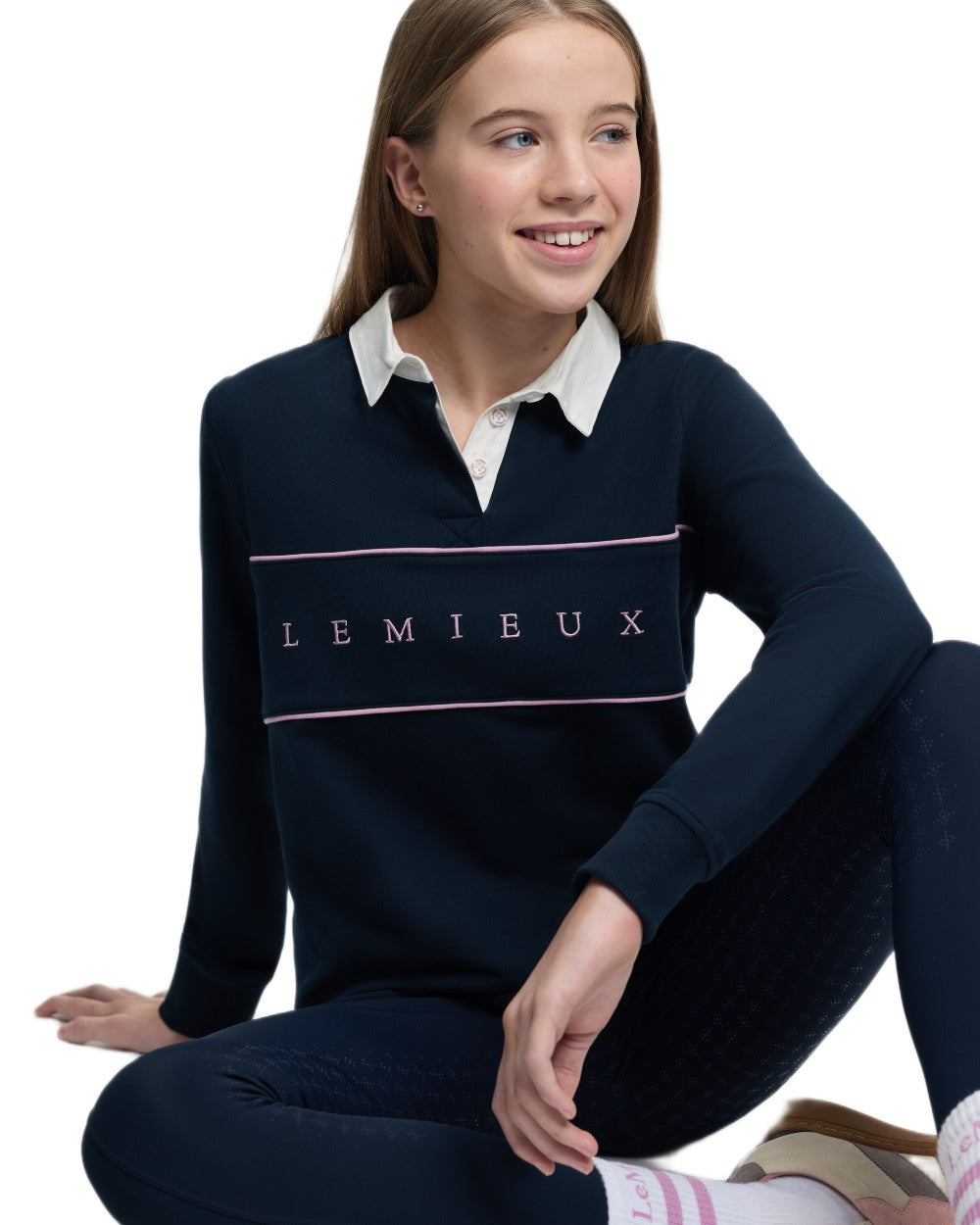 Navy coloured LeMieux Young Rider Riley Rugby Shirt on white background