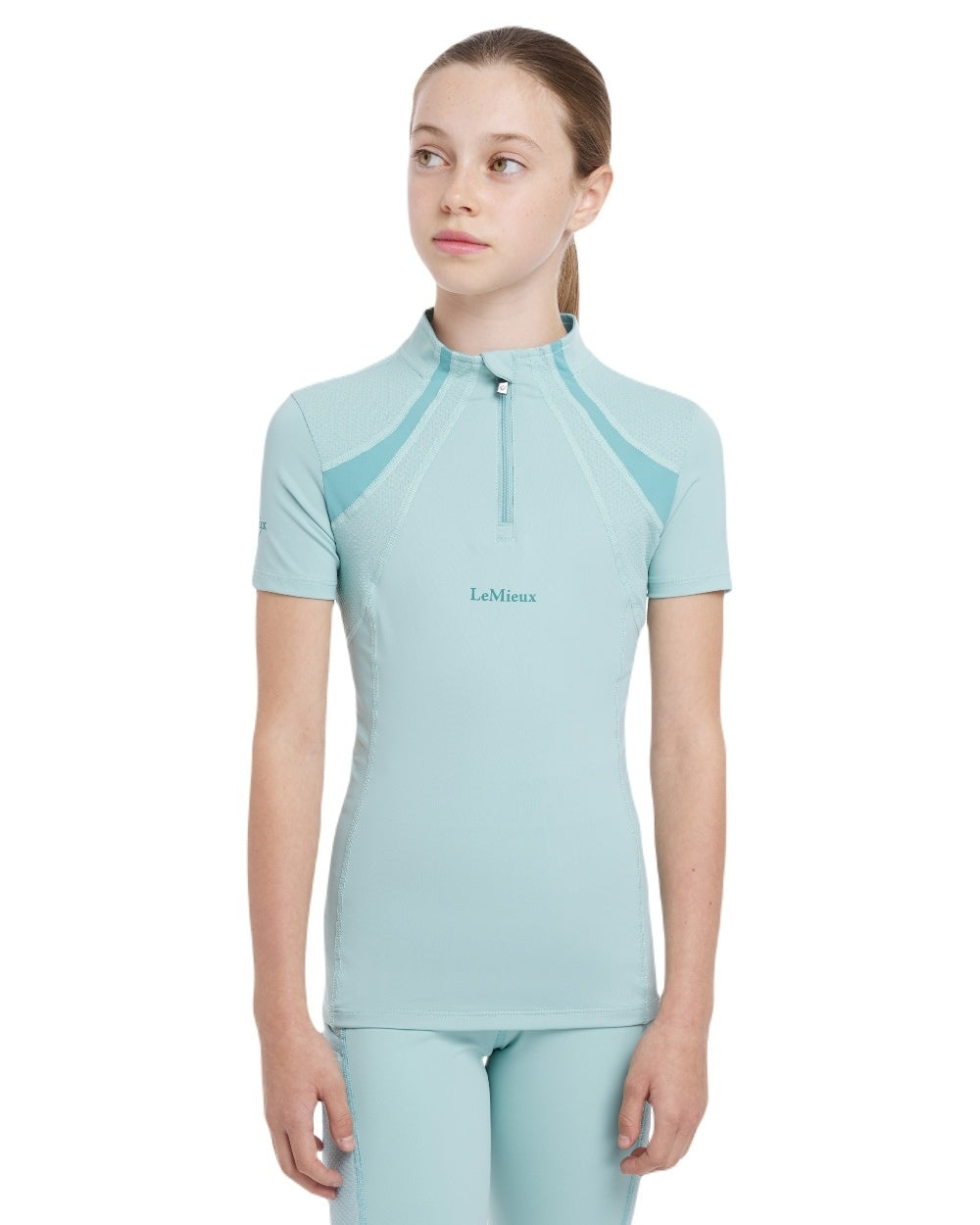 Aqua coloured LeMieux Young Rider Short Sleeve Mia Mesh Base Layer on white background