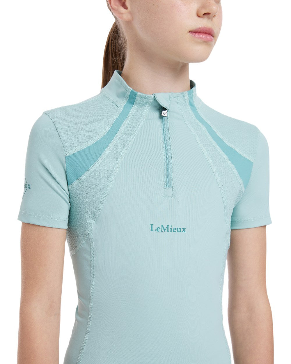 Aqua coloured LeMieux Young Rider Short Sleeve Mia Mesh Base Layer on white background