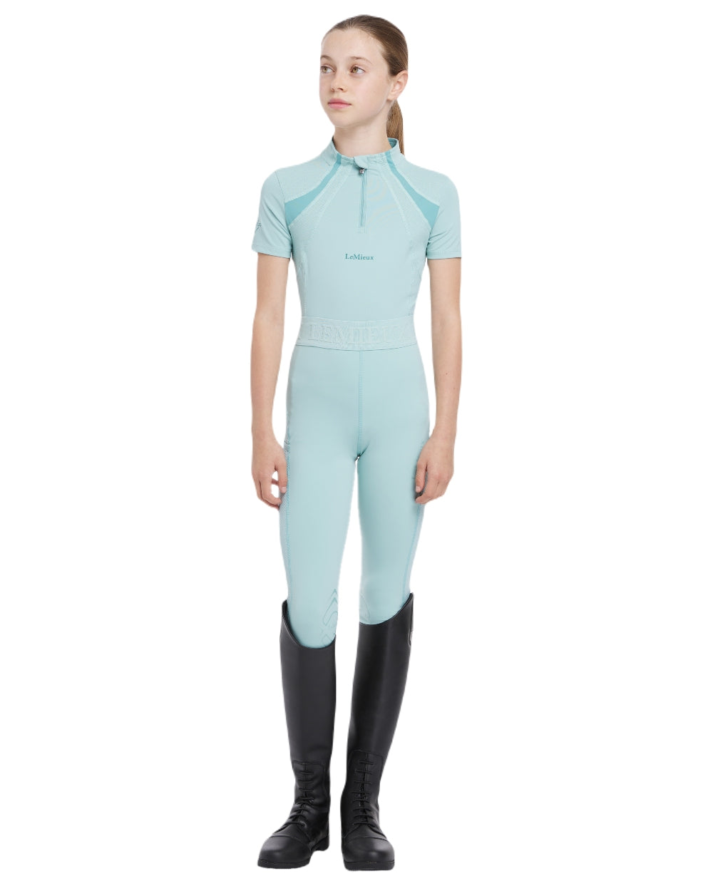 Aqua coloured LeMieux Young Rider Short Sleeve Mia Mesh Base Layer on white background