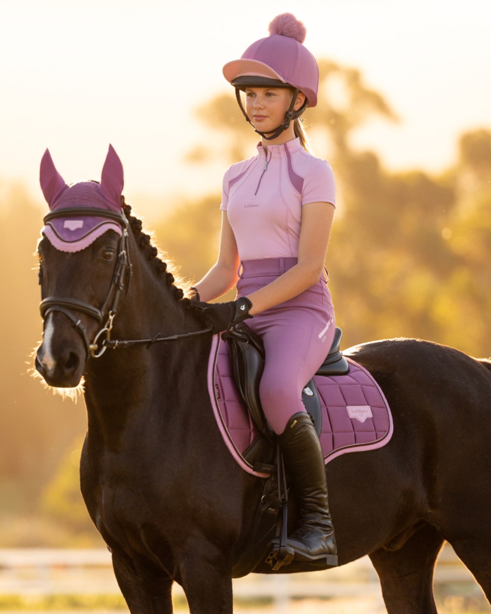 Fondant coloured LeMieux Young Rider Short Sleeve Mia Mesh Base Layer on outdoor background