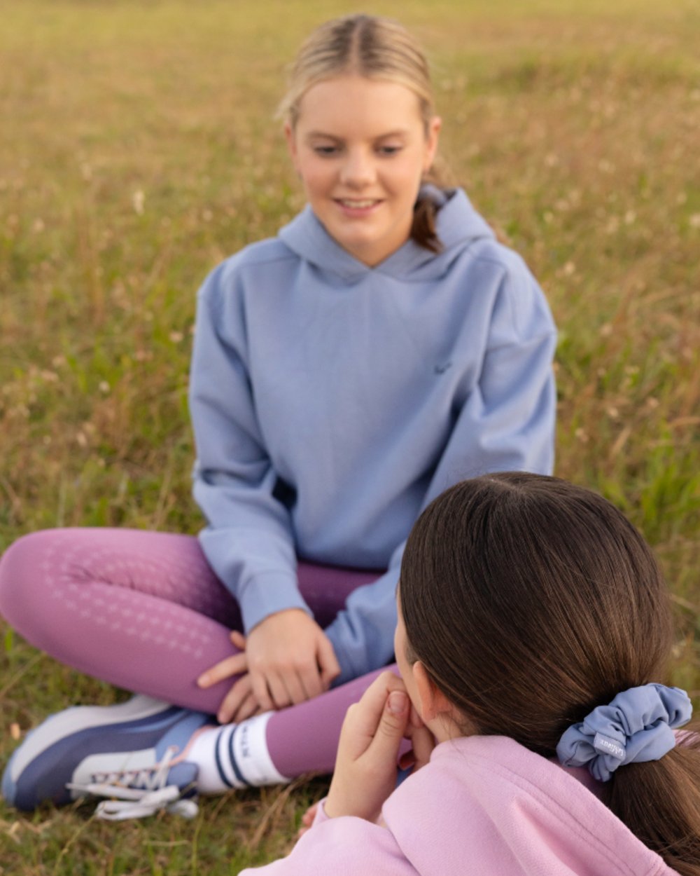 Powder Blue coloured LeMieux Young Rider Sia Hoodie on grass background