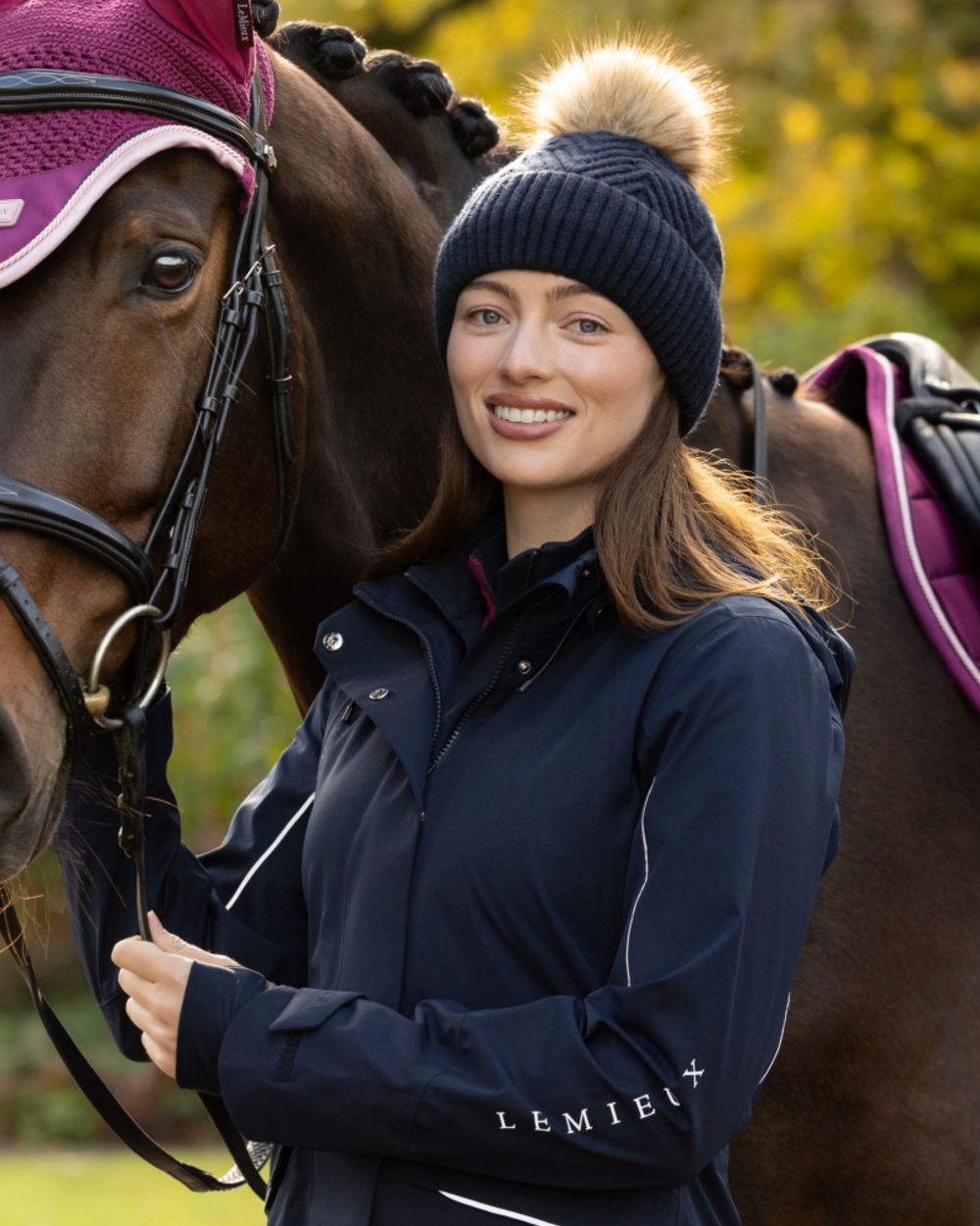 Navy coloured LeMieux Clara Knit Beanie on outdoor background