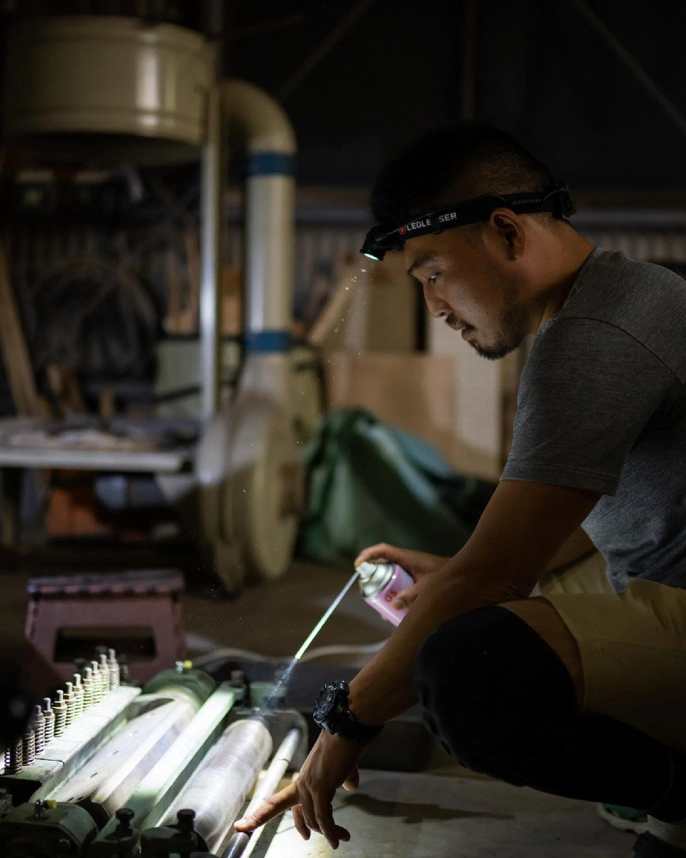 Black Coloured Led Lenser H5R Core Head Torch on garage background