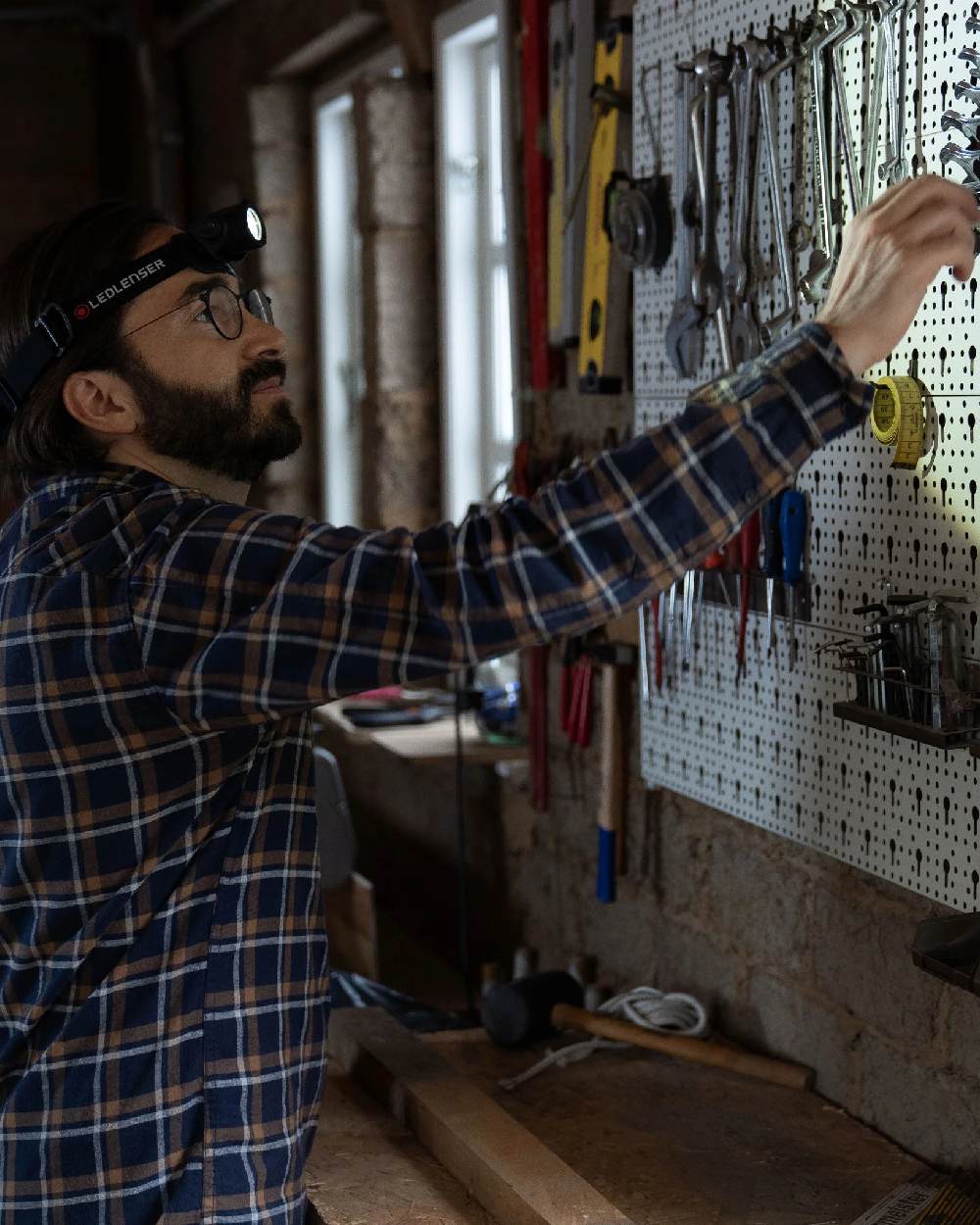 Black Coloured Led Lenser H5R Core Head Torch on garage background