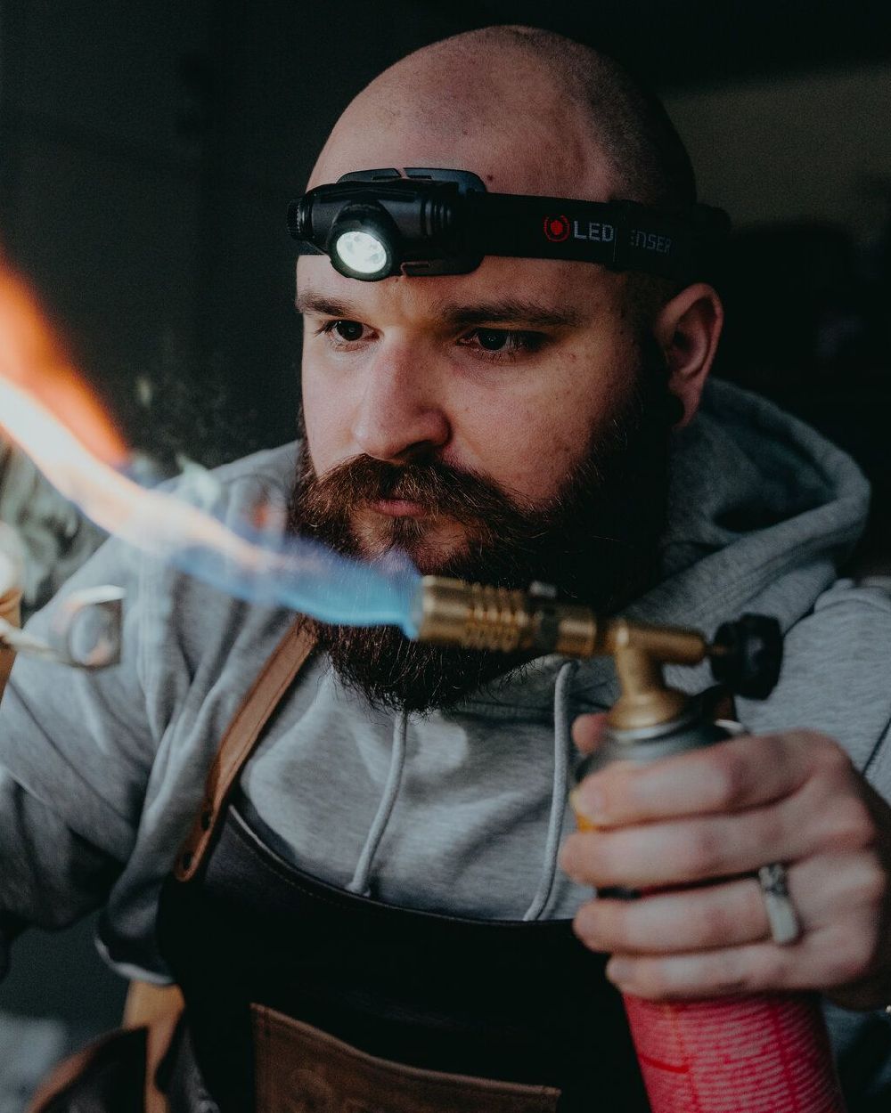 Black Coloured Led Lenser H5R Core Head Torch on blurry background