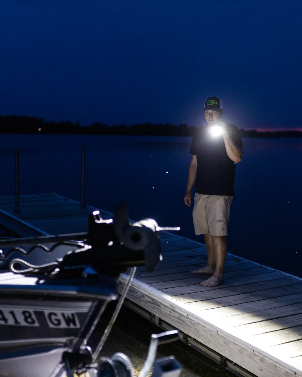 Espresso Brown Coloured Led Lenser P18R Signature Rechargeable Torch on lake background