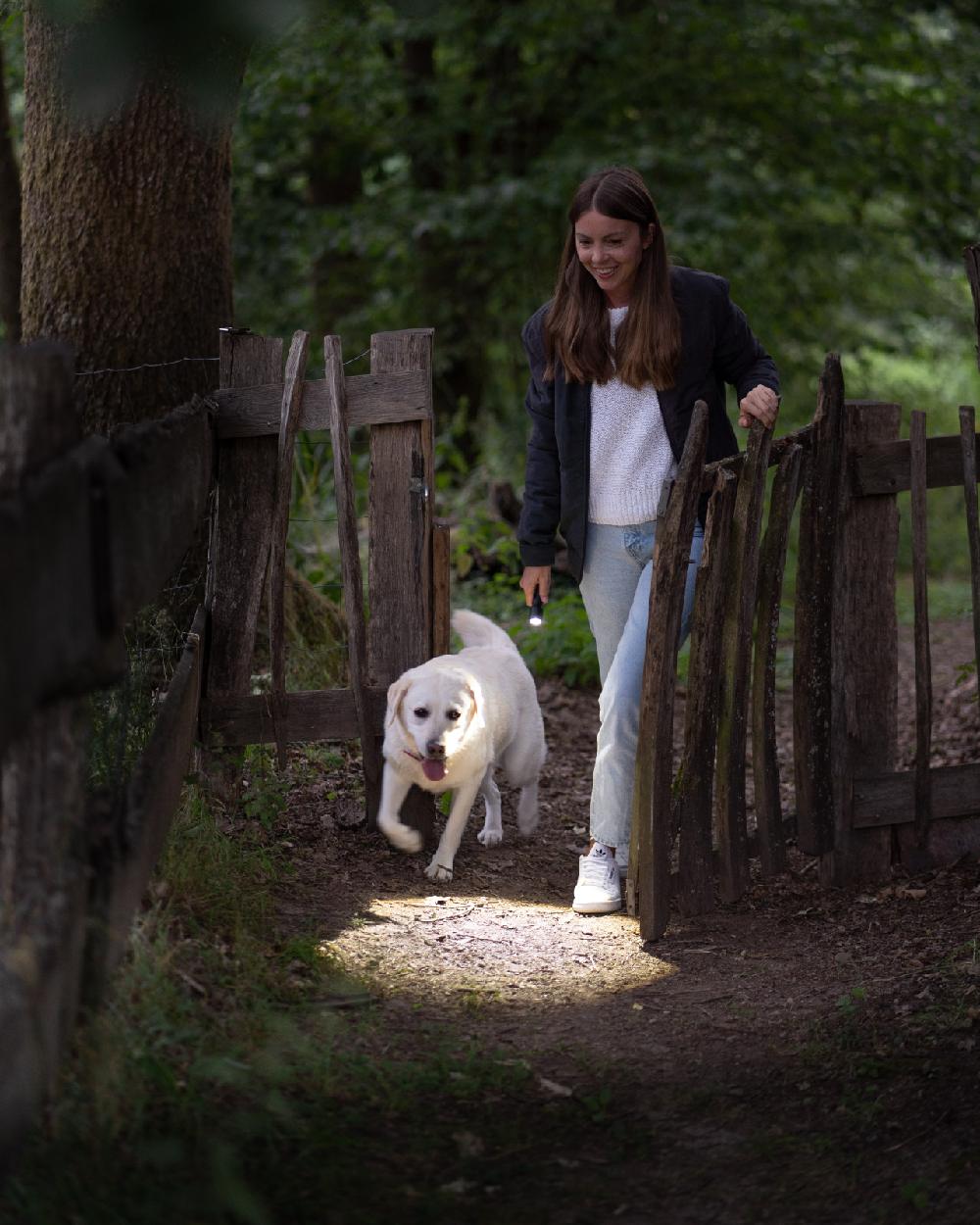 Black coloured Led Lenser P5R Core Rechargeable Torch on field background
