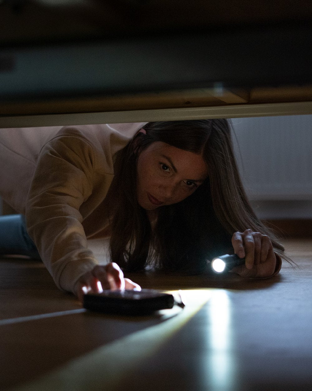 Black coloured Led Lenser P5R Core Rechargeable Torch on floor background