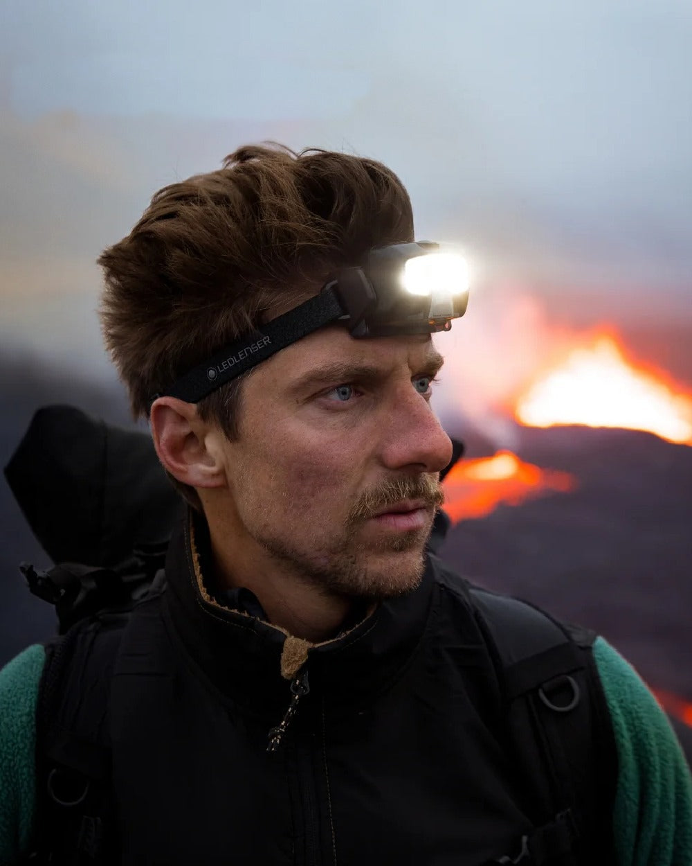 Black Coloured Led Lenser HF4R Core Rechargeable Head Torch on blurry background