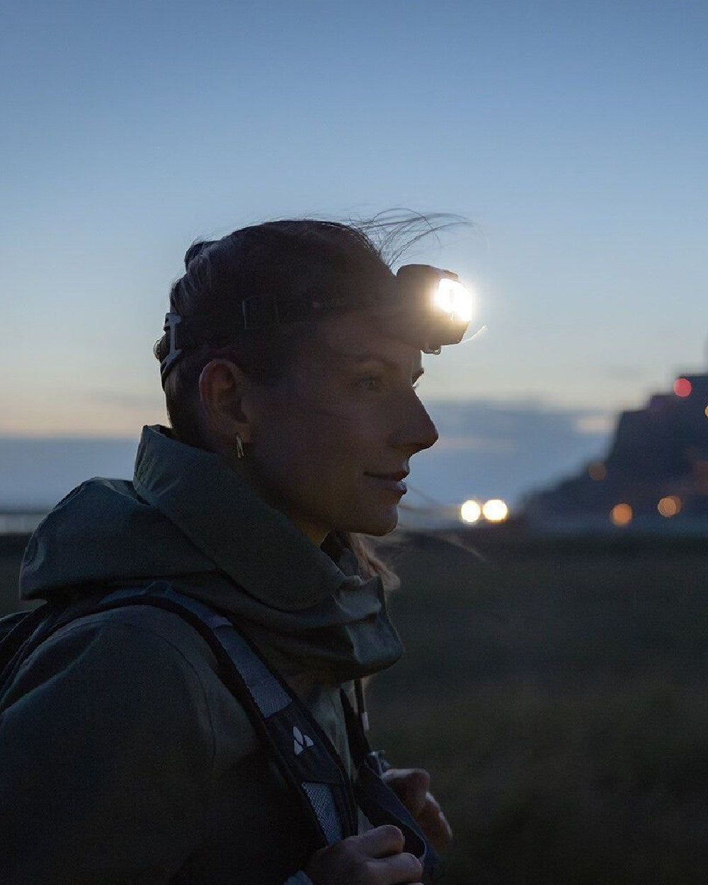 Black coloured Led Lenser HF8R Core Rechargeable Head Torch on sky background