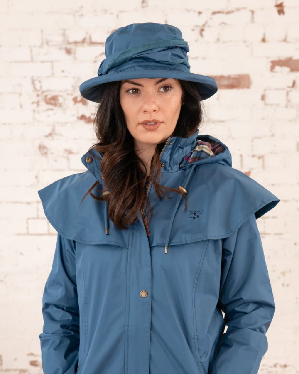 Deep Sea coloured Lighthouse Canterbury Waterproof Hat on wall background