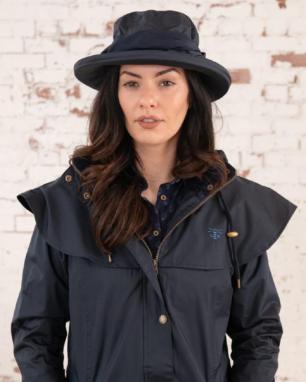 Nightshade coloured Lighthouse Canterbury Waterproof Hat on wall background