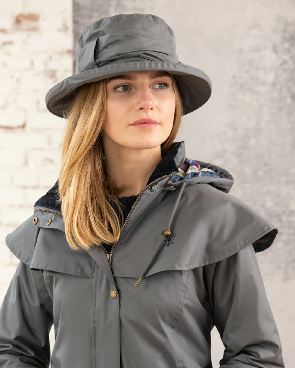 Urban Grey coloured Lighthouse Canterbury Waterproof Hat on wall background