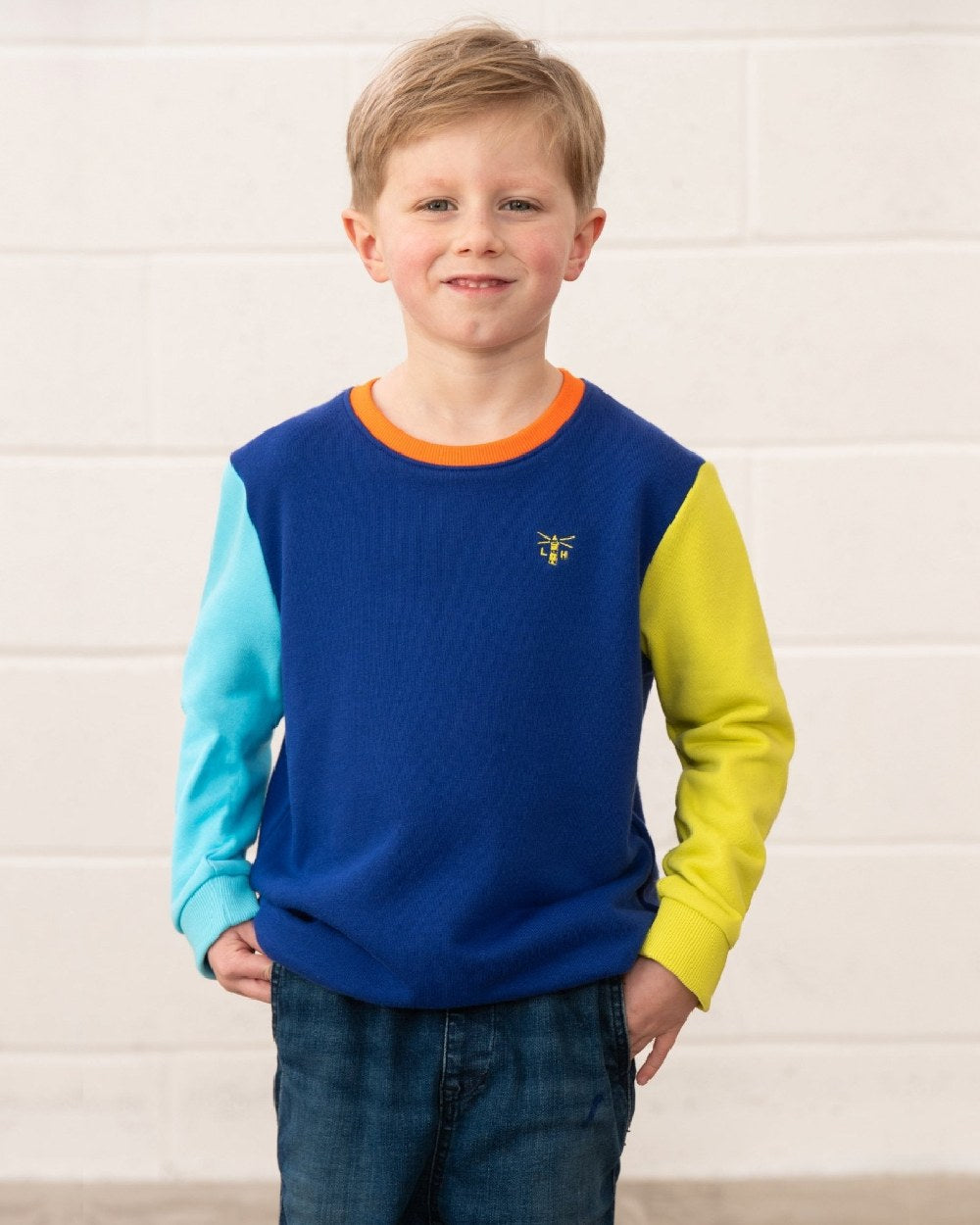 Blue Navy Lime coloured Lighthouse Childrens Finn Jersey on wall background