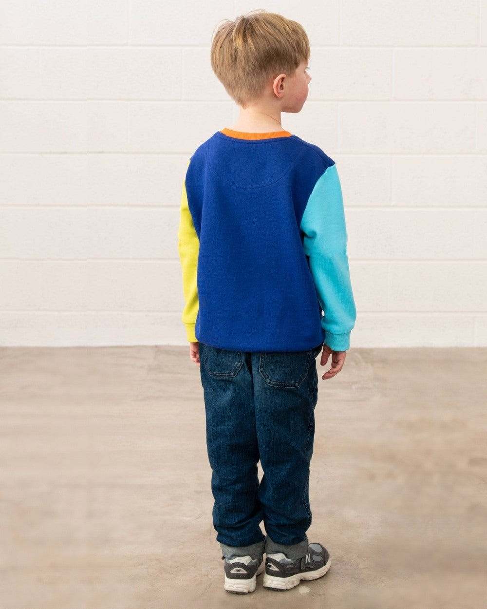 Blue Navy Lime coloured Lighthouse Childrens Finn Jersey on wall background