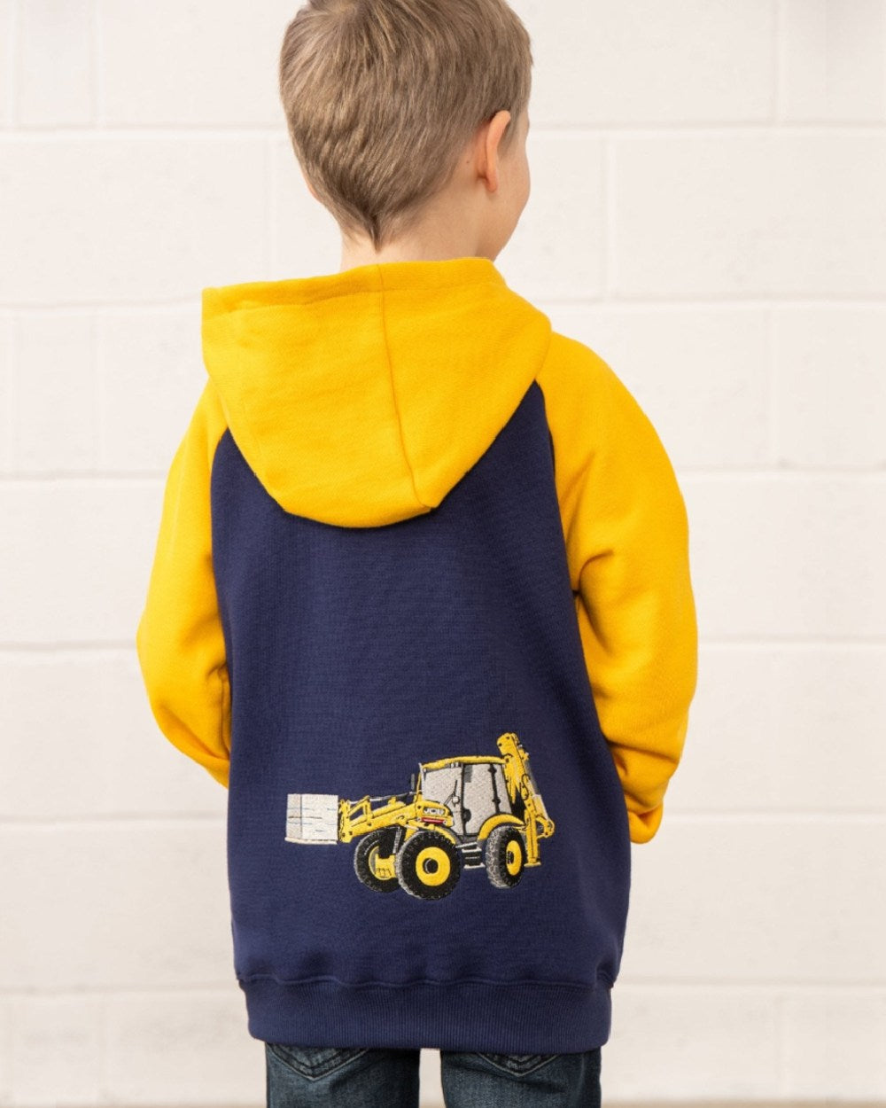 Navy JCB coloured Lighthouse Jackson Childrens Full Zip Hoodie on wall background