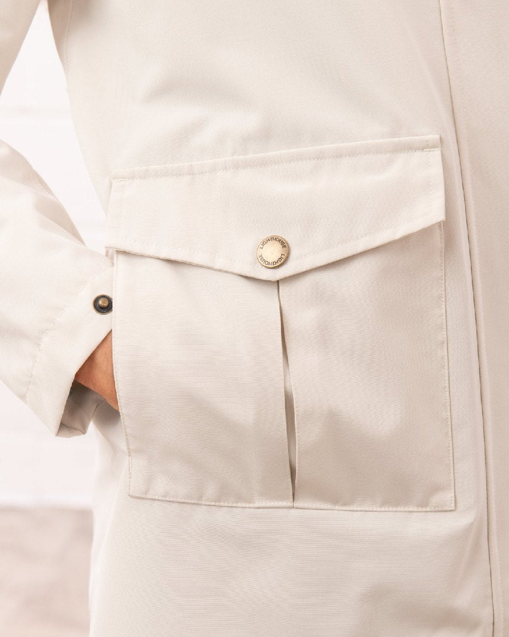 Cream coloured Lighthouse Ladies Annika Coat on wall background