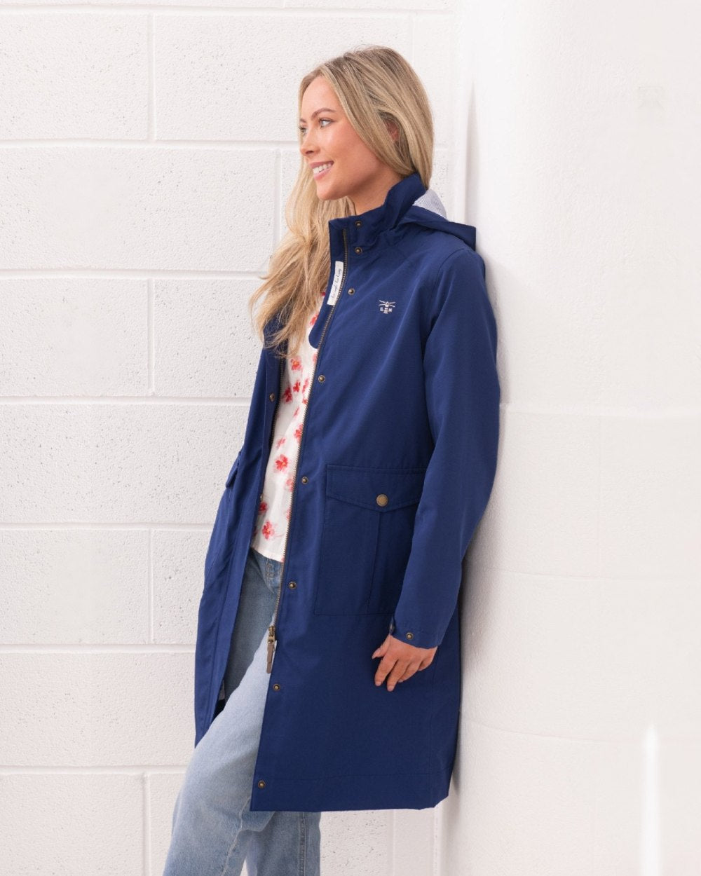 Indigo coloured Lighthouse Ladies Annika Coat on wall background