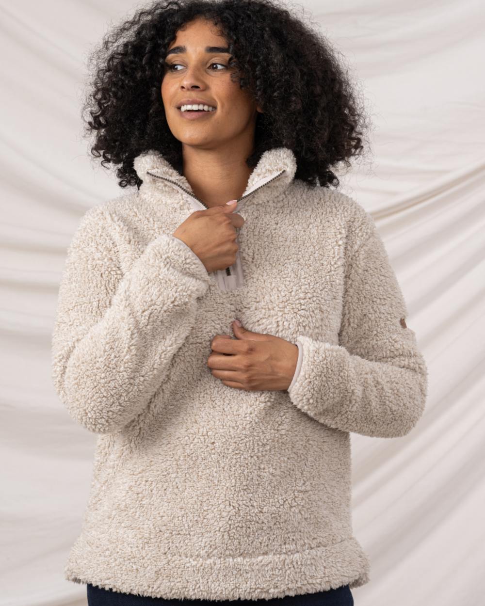 Irish Cream coloured Lighthouse Ladies Coast Half Zip Fleece Sweater on curtain background