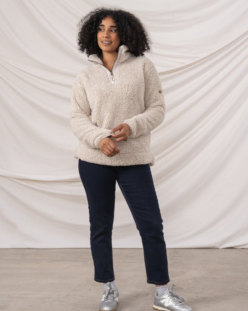 Irish Cream coloured Lighthouse Ladies Coast Half Zip Fleece Sweater on curtain background