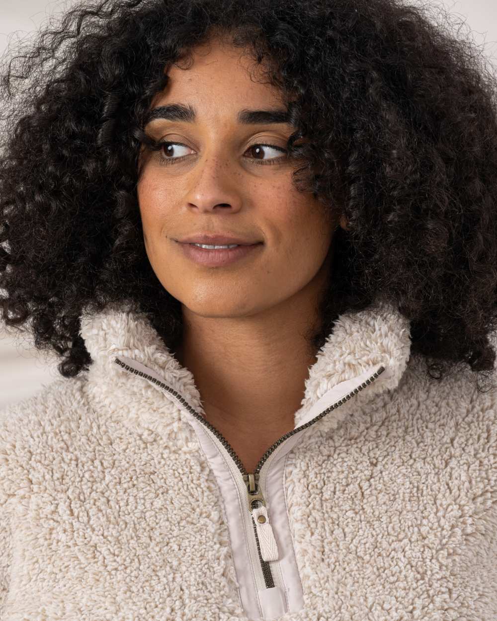 Irish Cream coloured Lighthouse Ladies Coast Half Zip Fleece Sweater on curtain background