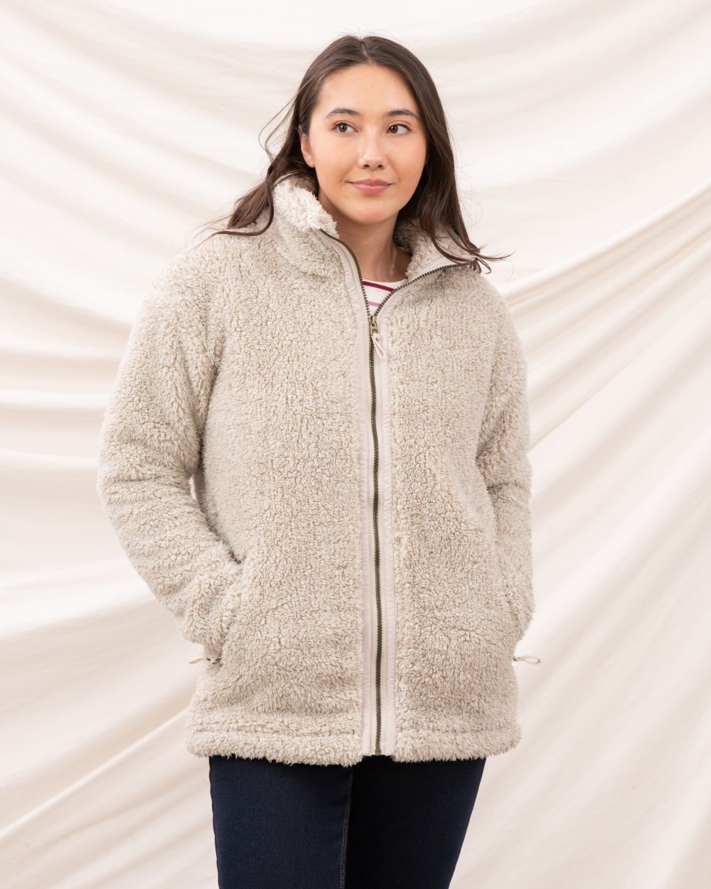 Irish Cream coloured Lighthouse Ladies Cobh Full Zip Fleece Jacket on curtain background