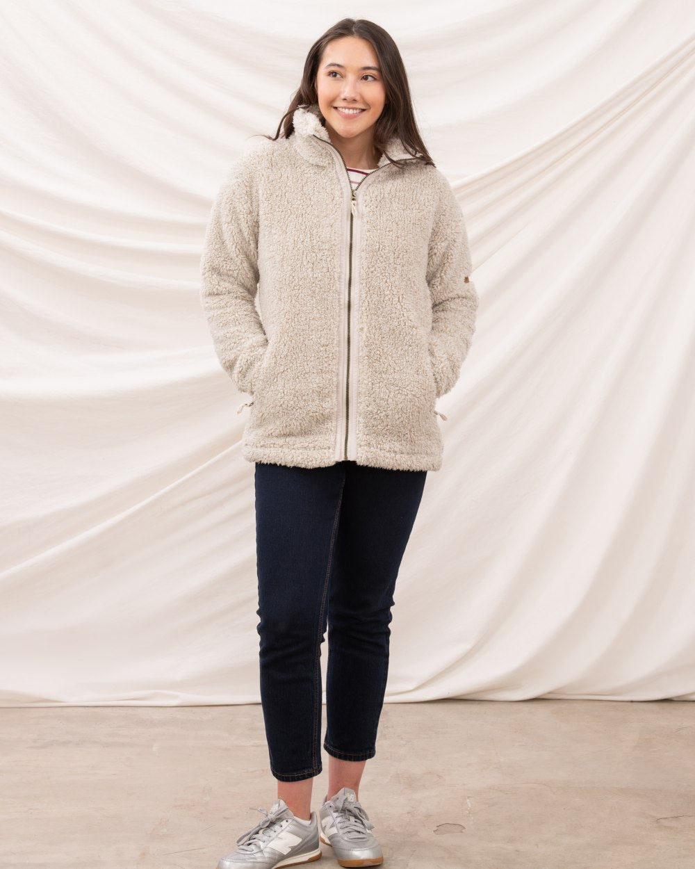 Irish Cream coloured Lighthouse Ladies Cobh Full Zip Fleece Jacket on curtain background