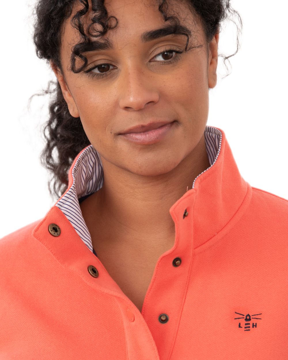 Coral coloured Lighthouse Ladies Haven II Jersey on white background