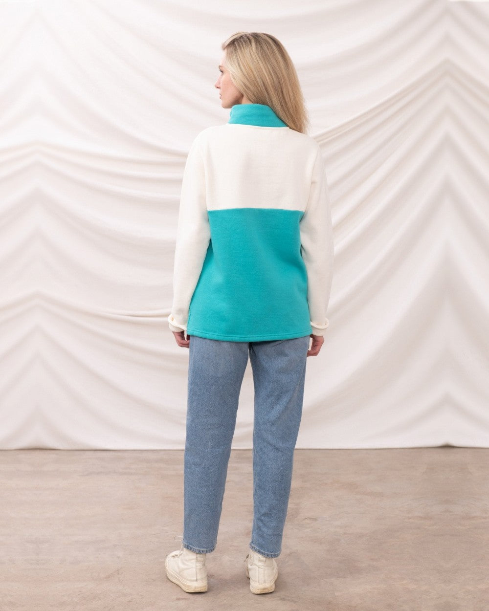 Coconut Soft Teal coloured Lighthouse Ladies Haven Jersey on curtain background