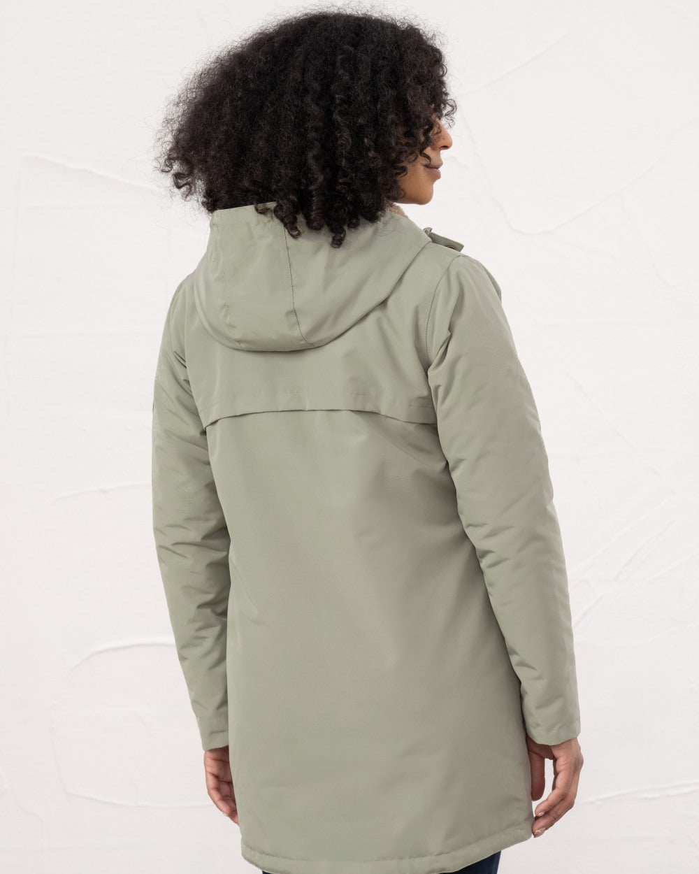 Brushwood coloured Lighthouse Ladies Scarlet Coat on wall background