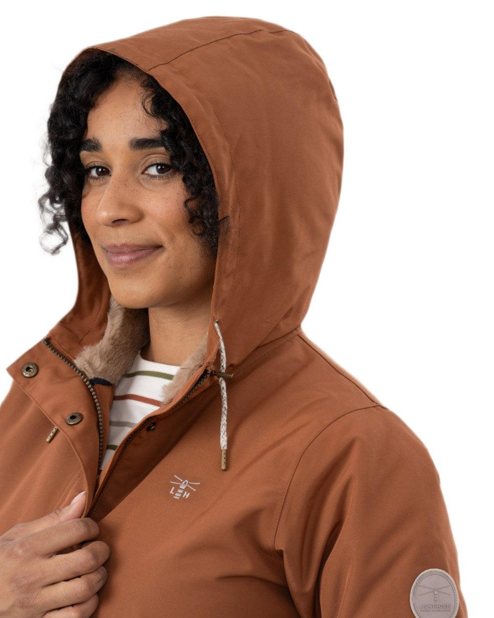 Rust coloured Lighthouse Ladies Scarlet Coat on wall background