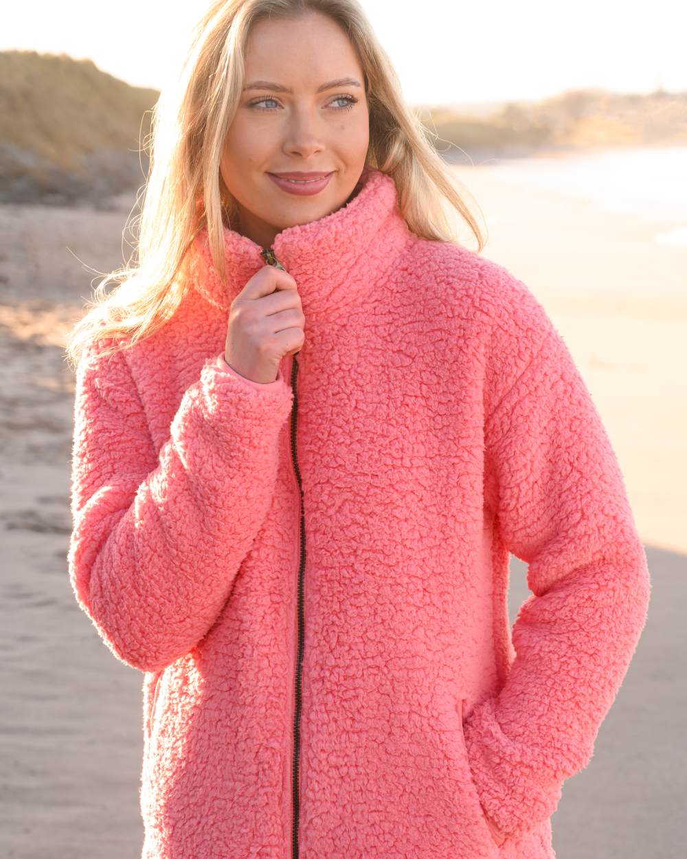 Sugar Coral coloured Lighthouse Ladies Seashell Full Zip Sherpa Fleece on blurry background