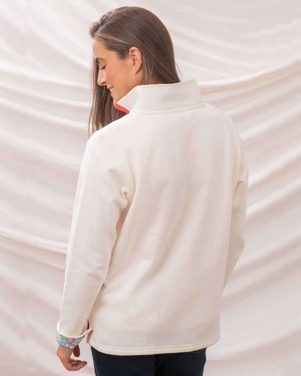 Coconut coloured Lighthouse Ladies Shore Sweatshirt on curtain background