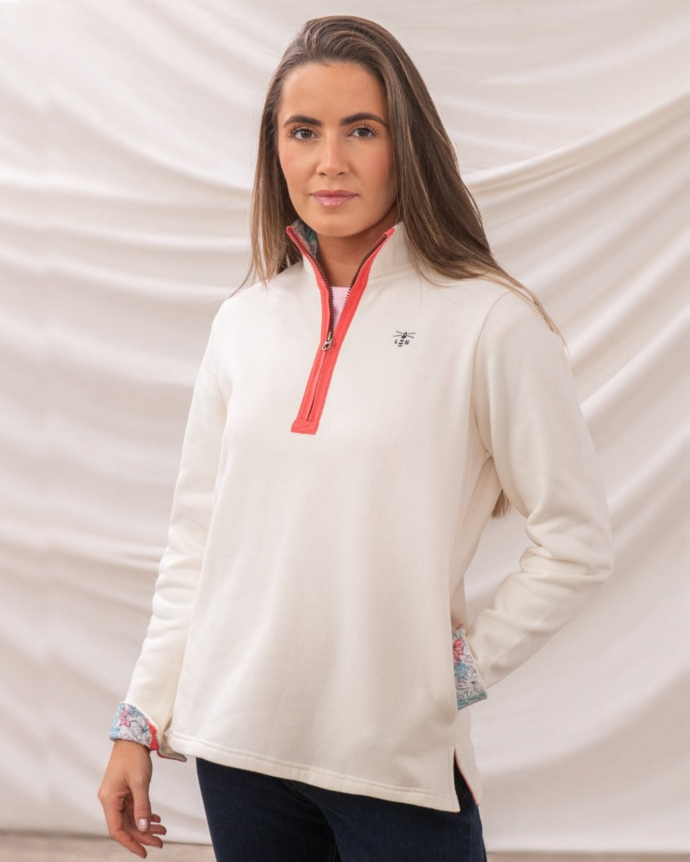 Coconut coloured Lighthouse Ladies Shore Sweatshirt on curtain background