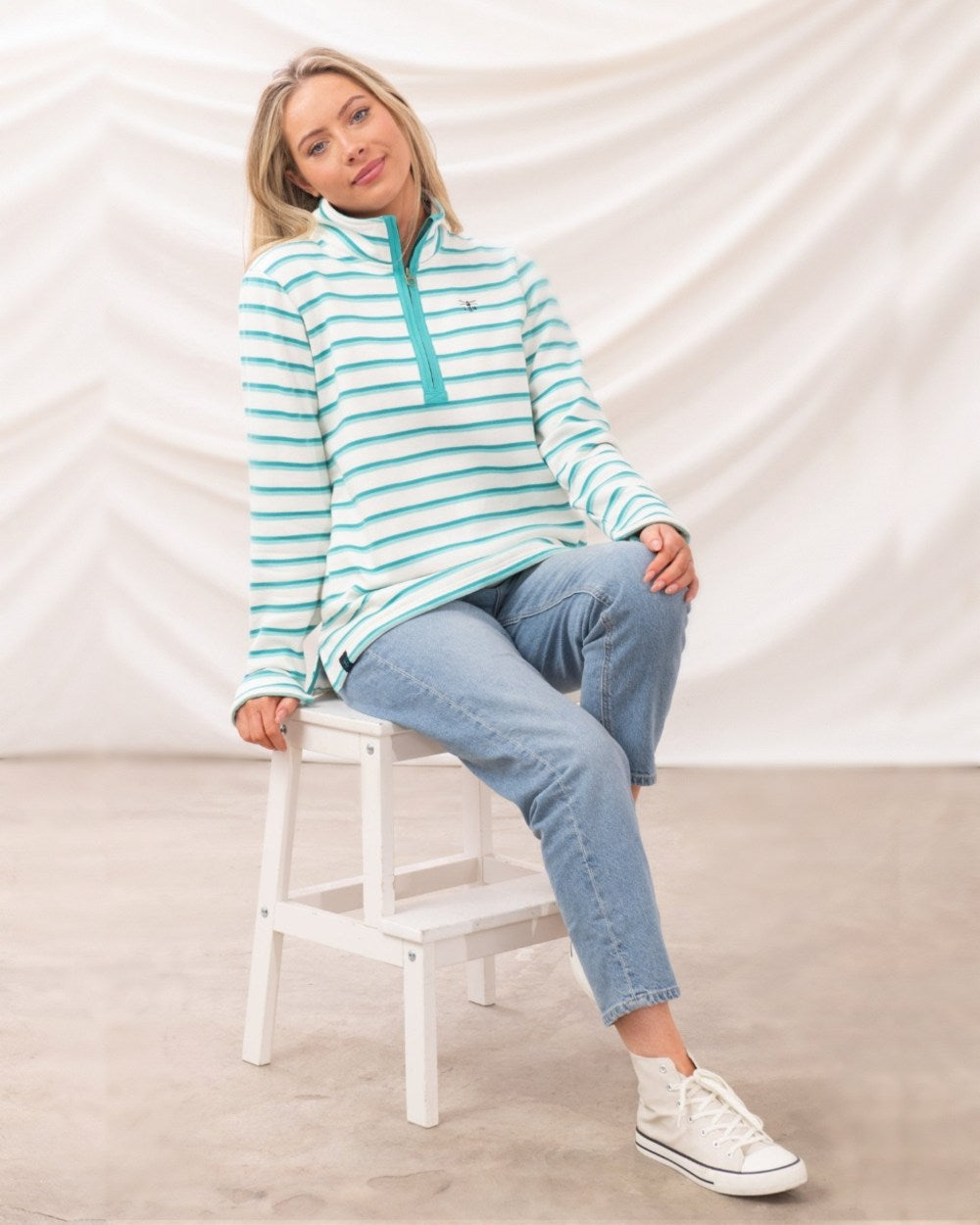 Soft Teal Stripe coloured Lighthouse Ladies Shore Sweatshirt on curtain background