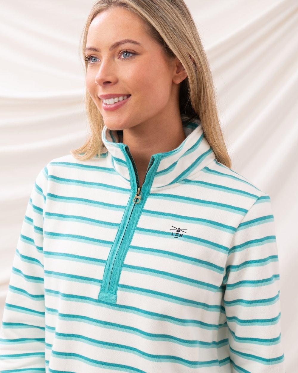 Soft Teal Stripe coloured Lighthouse Ladies Shore Sweatshirt on curtain background