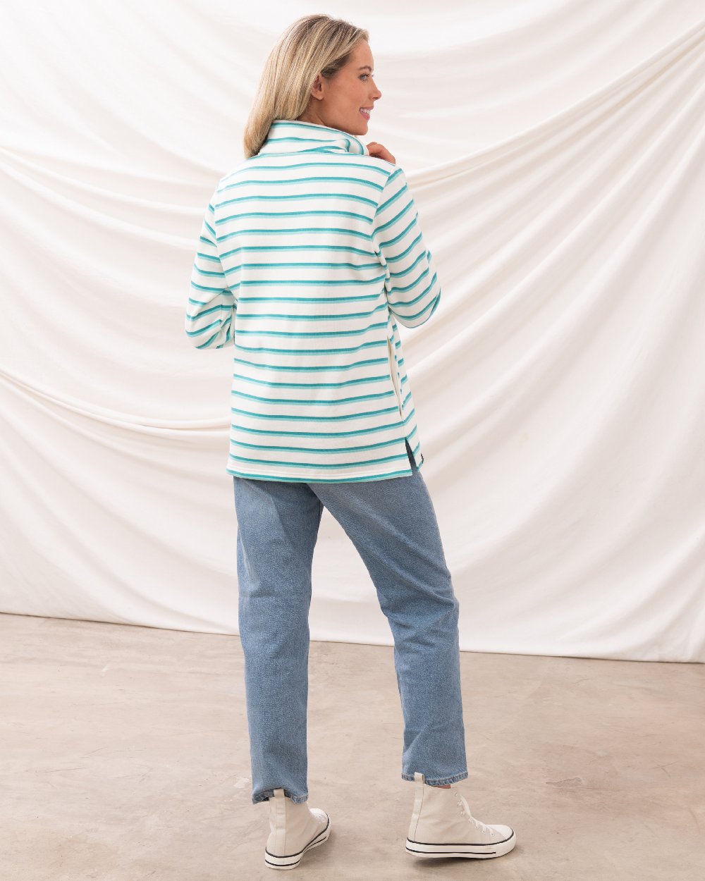 Soft Teal Stripe coloured Lighthouse Ladies Shore Sweatshirt on curtain background