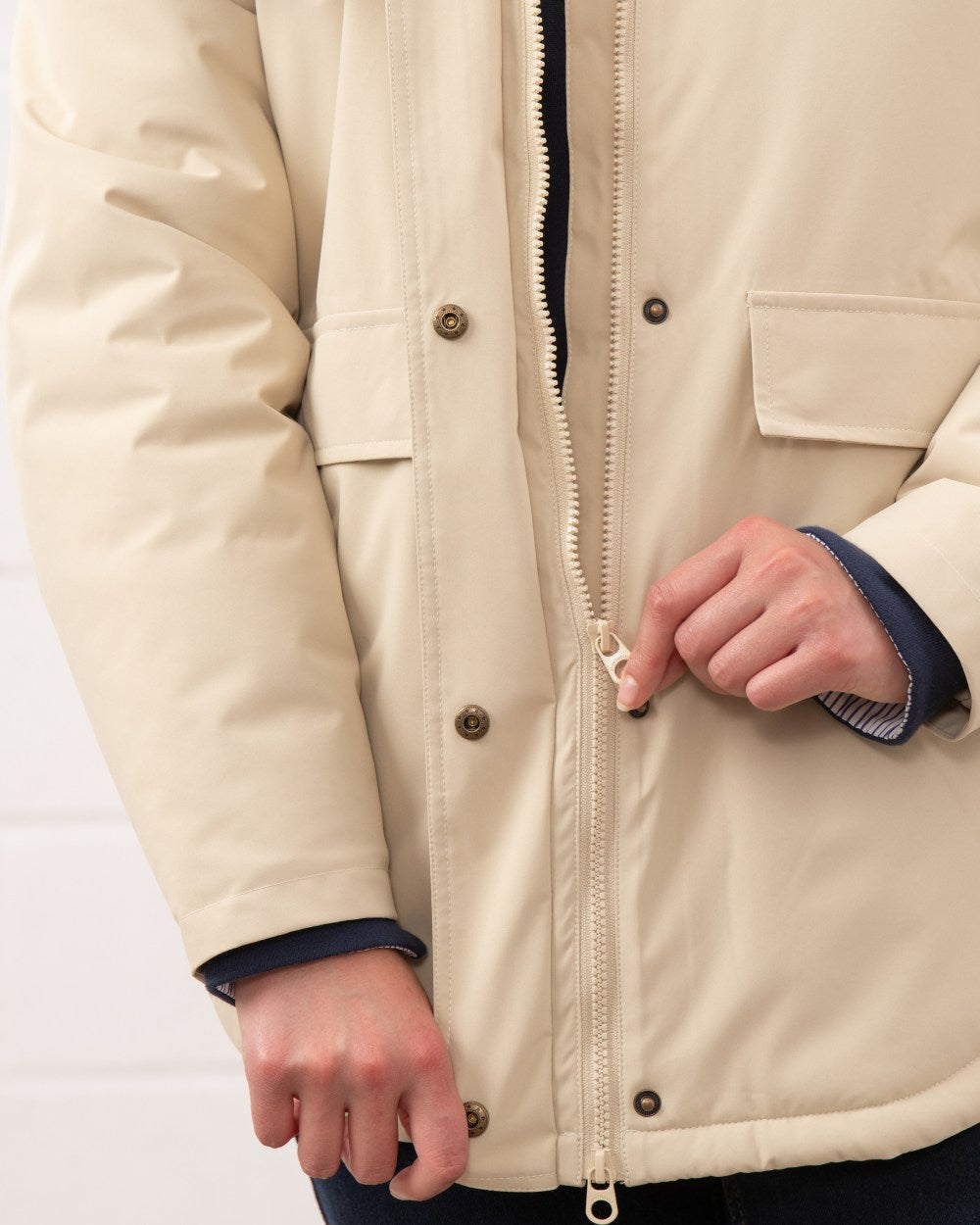 Cream coloured Lighthouse Ladies Tess Coat on wall background