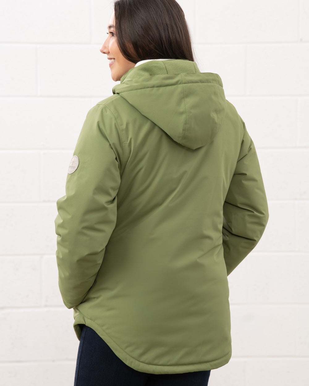 Sea Kelp coloured Lighthouse Ladies Tess Coat on wall background