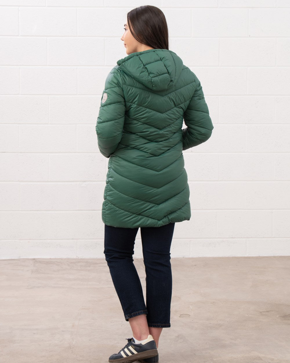 Kale coloured Lighthouse Laurel Ladies Coat on wall background