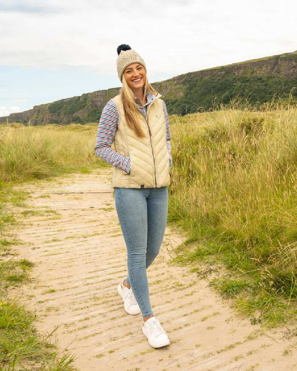 Almond coloured Lighthouse Laurel Ladies Gilet on lawn background