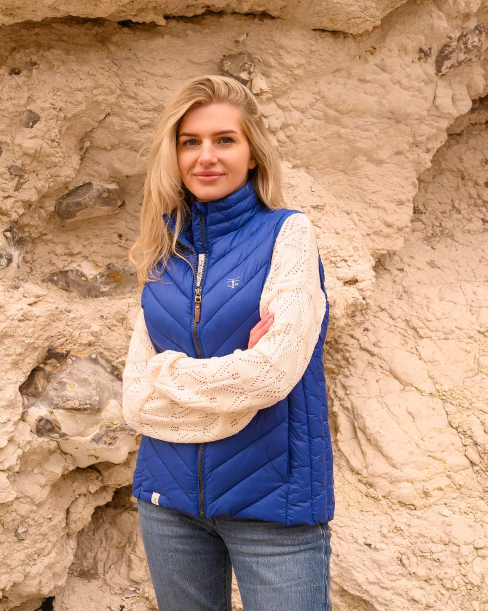 Indigo coloured Lighthouse Laurel Ladies Gilet on rock background