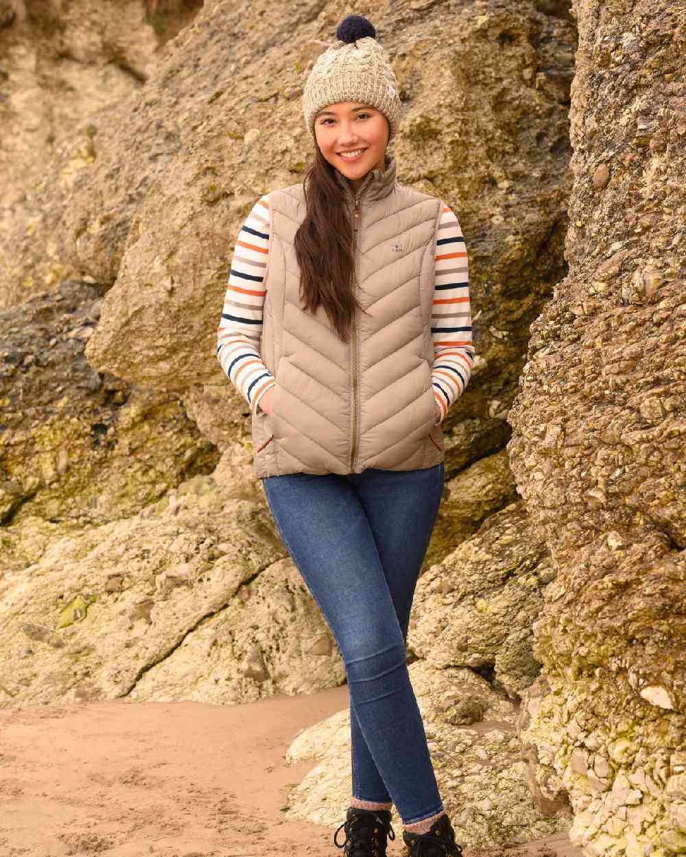 Mocha coloured Lighthouse Laurel Ladies Gilet on rock background