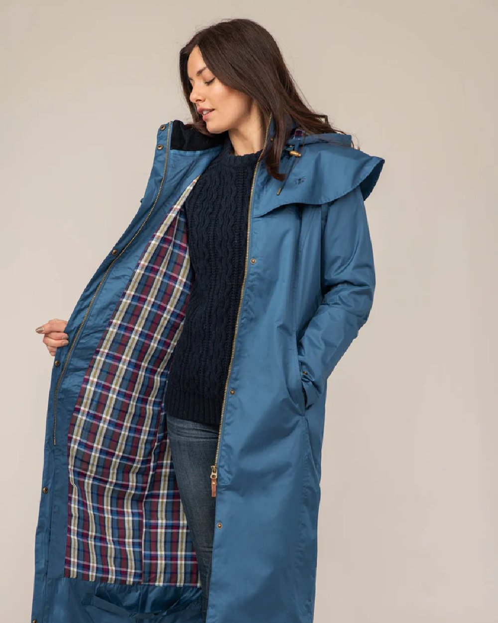 Deep Sea coloured Lighthouse Outback Full Length Ladies Waterproof Raincoat on wall background