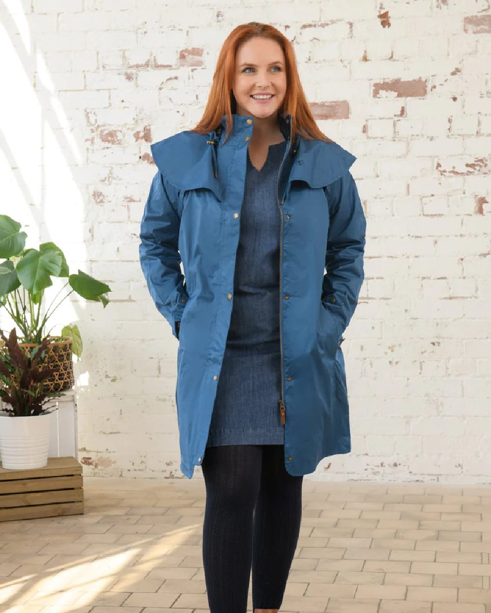 Deep Sea coloured Lighthouse Outrider 3/4 Length Ladies Waterproof Raincoat on wall background
