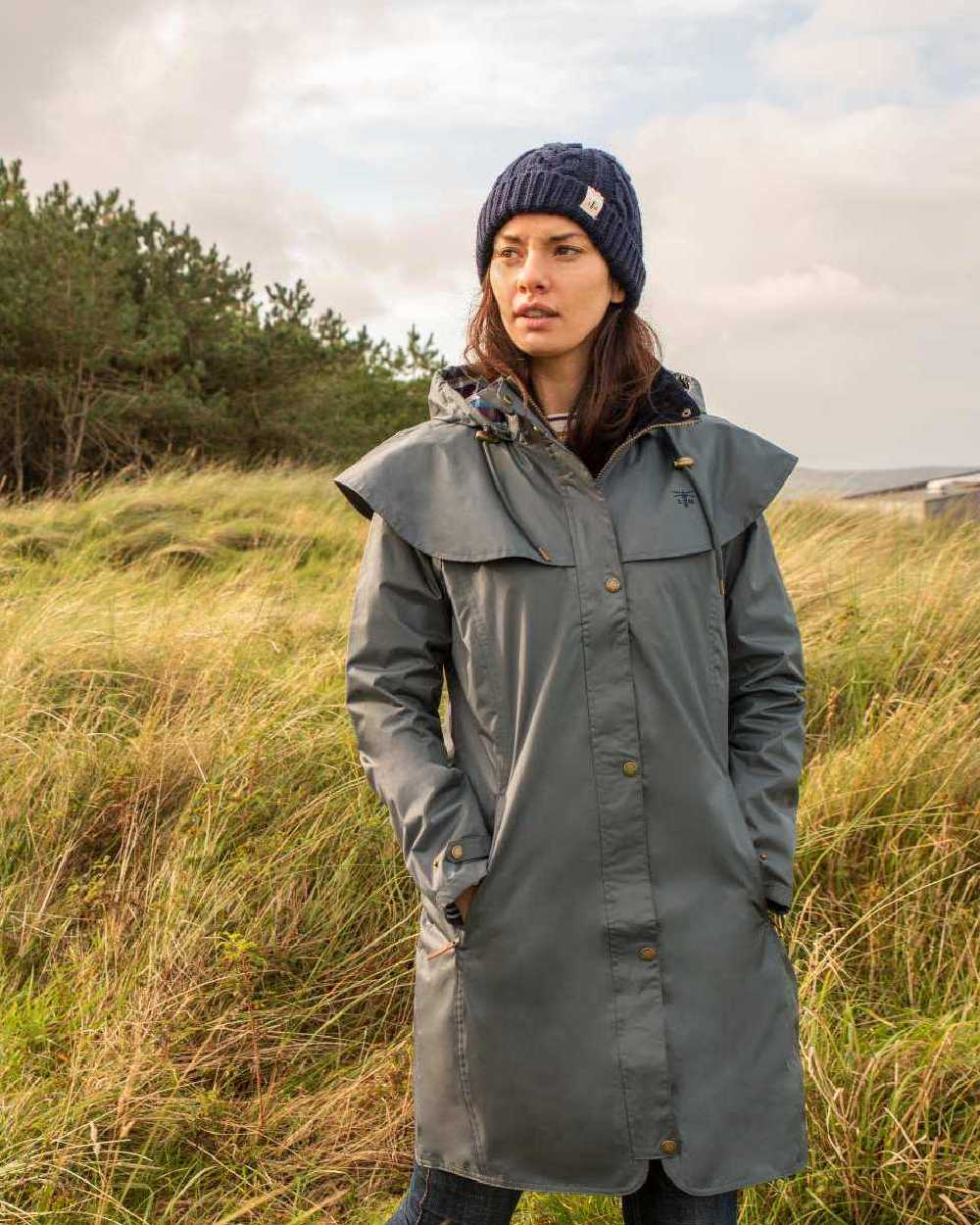 Urban Grey coloured Lighthouse Outrider 3/4 Length Ladies Waterproof Raincoat on grassy background