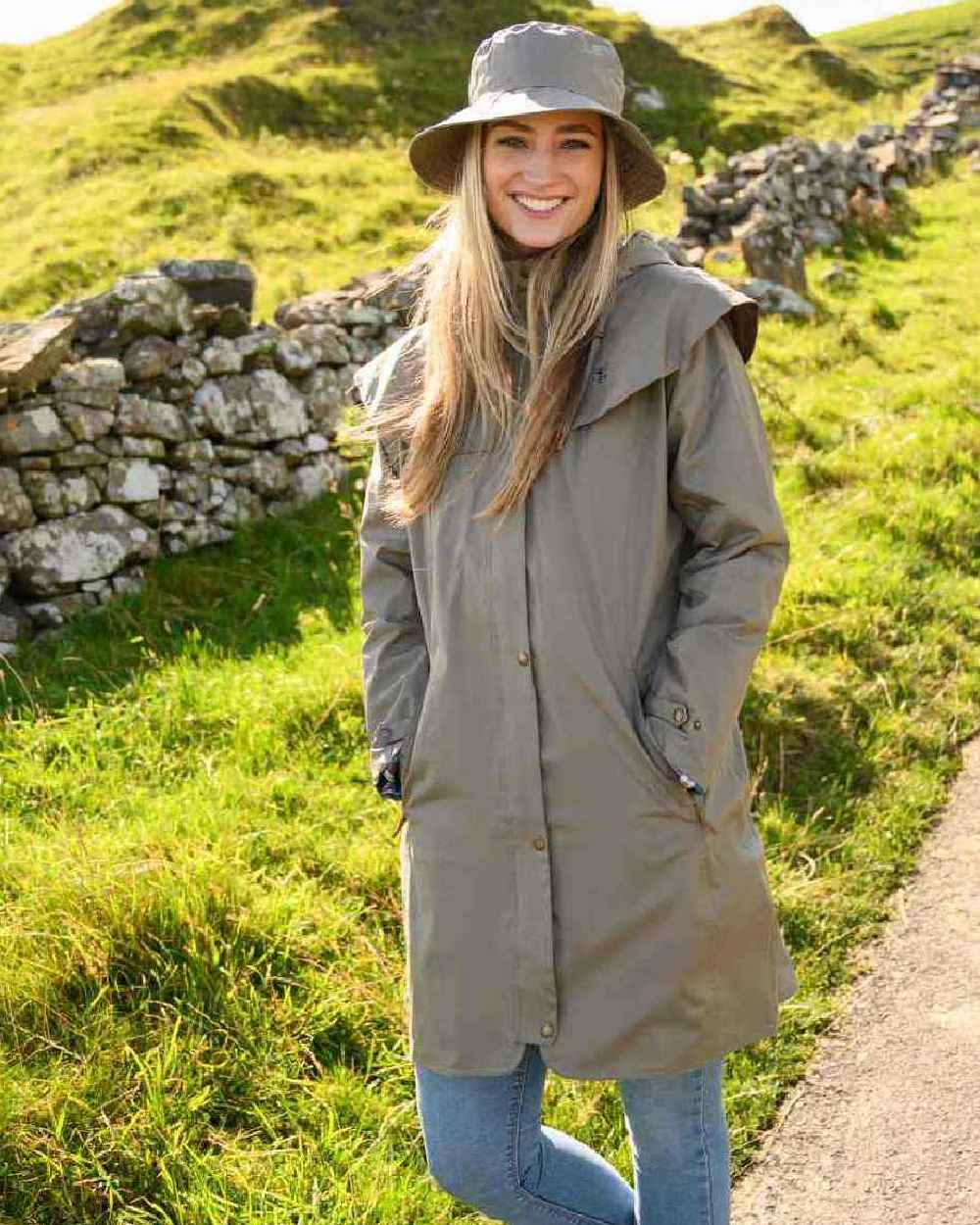 Urban Grey coloured Lighthouse Outrider 3/4 Length Ladies Waterproof Raincoat on grassy background